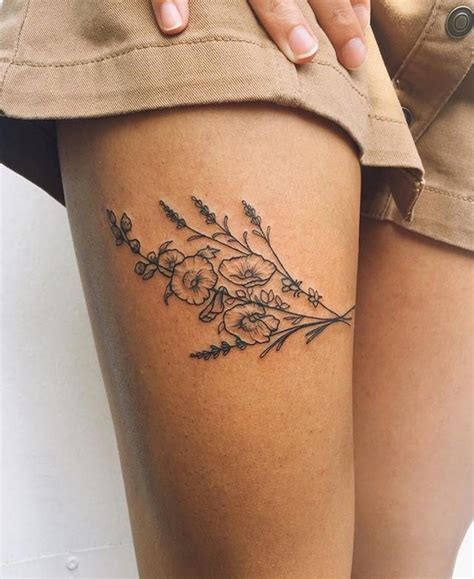 flower tattoo designs thigh|flower upper thigh tattoo.